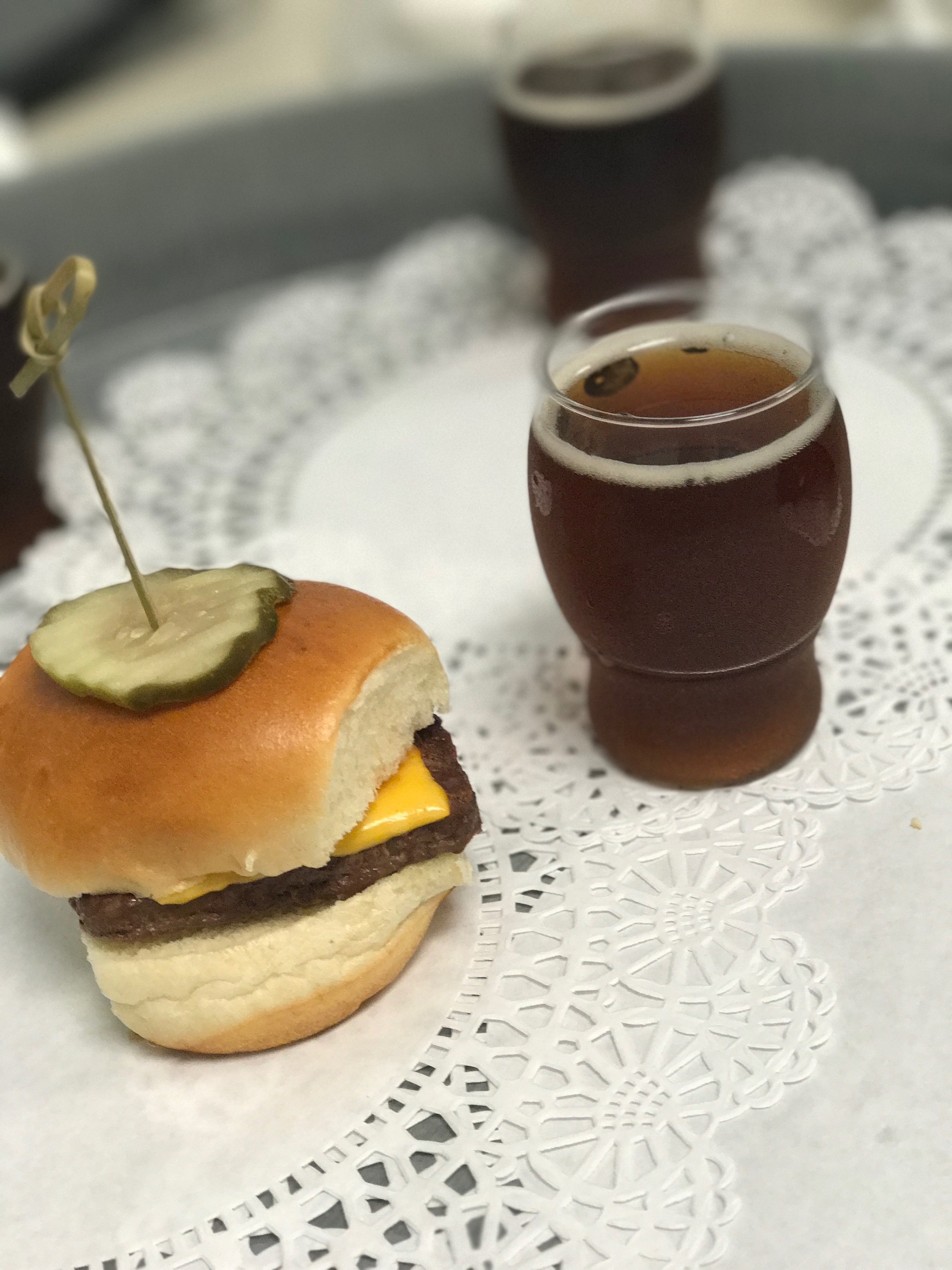 cheeseburger slider with a brown ale sipper